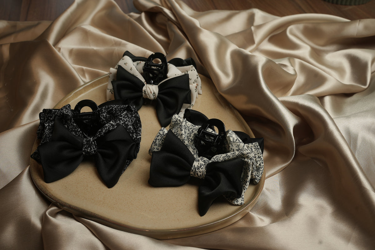 Dual bow styled claw