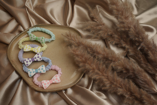 Bow styled rubber band